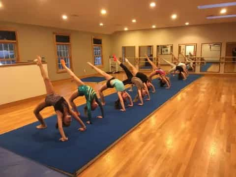 a group of people doing yoga