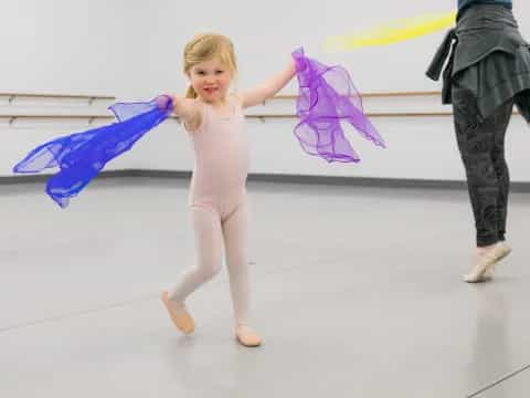 a girl holding a kite