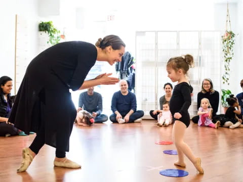 a person and a girl dancing