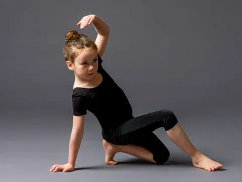 a young girl doing yoga
