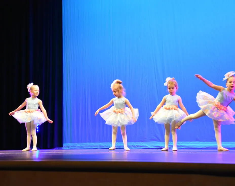 a group of girls on a stage