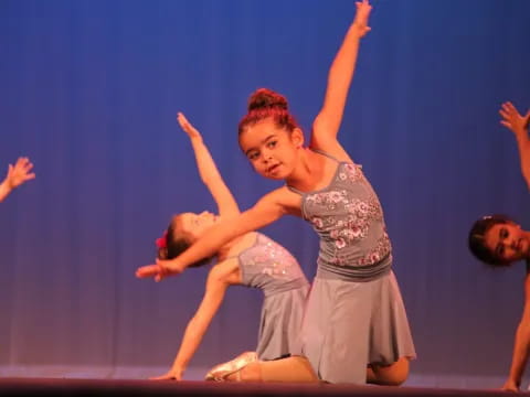 a group of people dancing on a stage