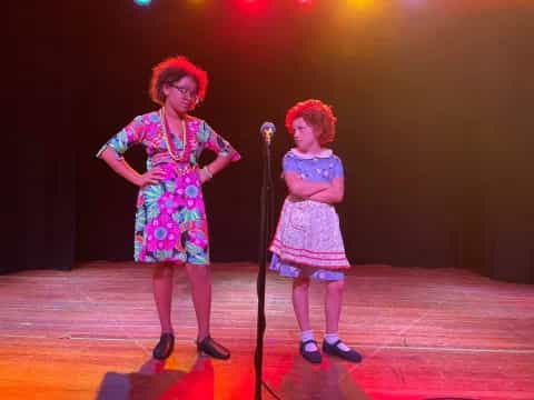 two girls on a stage