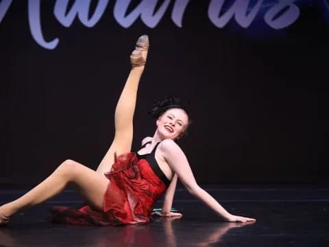 a woman dancing on a stage