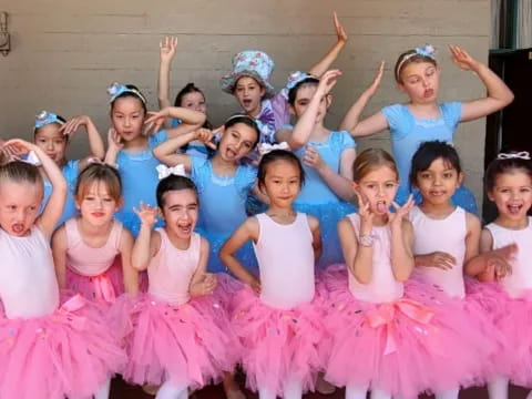 a group of girls in dresses