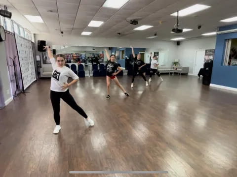 a group of people exercising in a gym