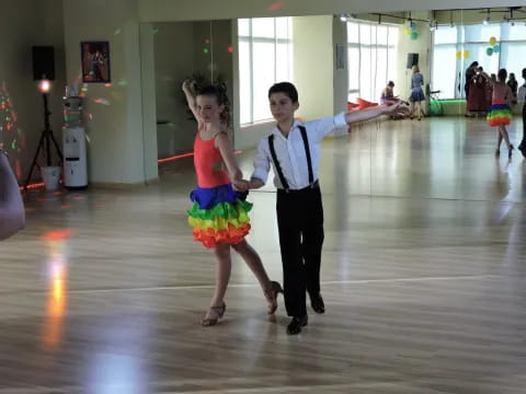 a person and a girl dancing