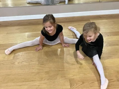 a group of girls doing yoga