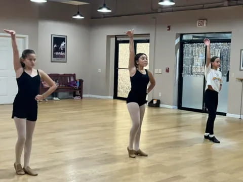 a group of women dancing in a room