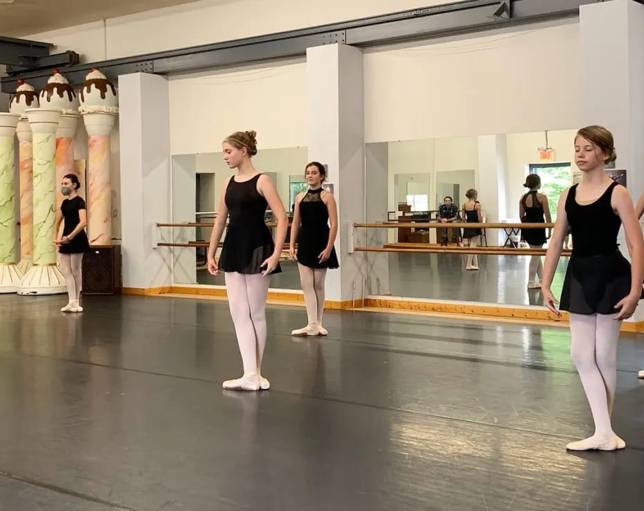 a group of women dancing in a room