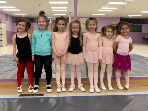 a group of girls posing for a photo