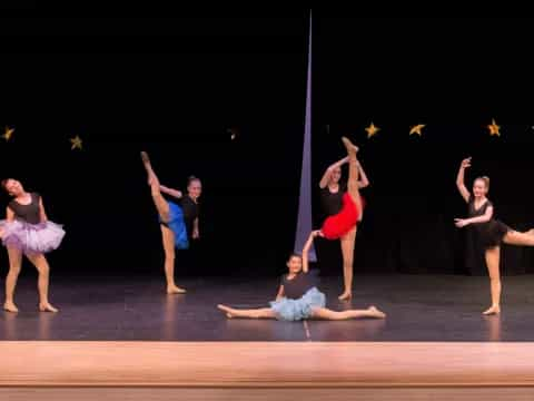 a group of people dancing on a stage