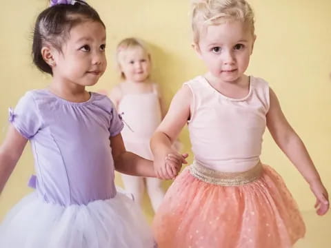 a group of children in dresses