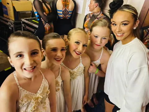 a group of girls posing for a photo