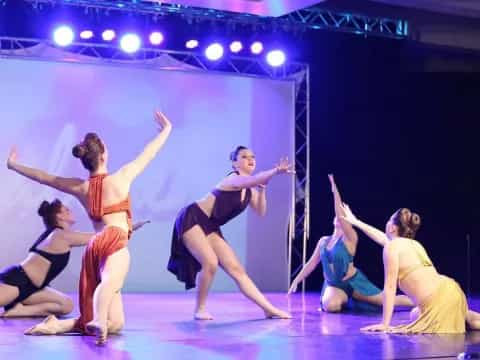 a group of women dancing on a stage