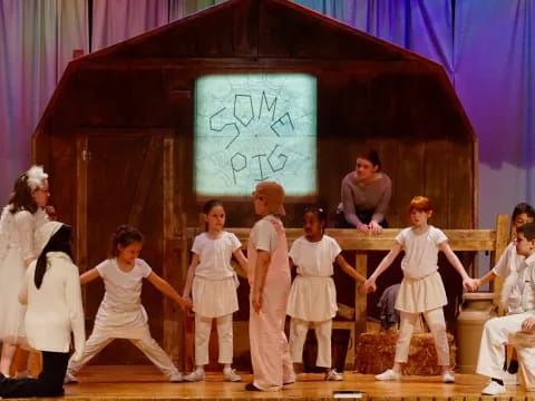 a group of children performing on a stage