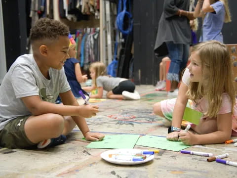 a boy and girl painting
