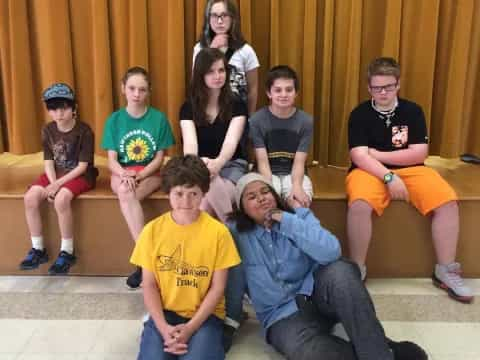 a group of people sitting on a bench