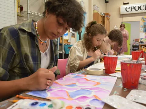 a group of people painting