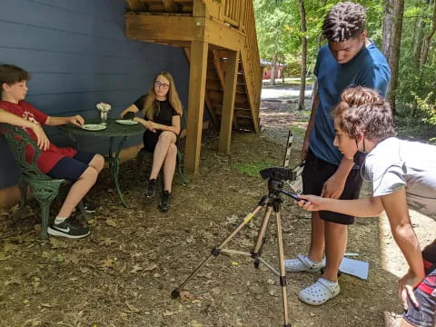 a group of people sitting outside