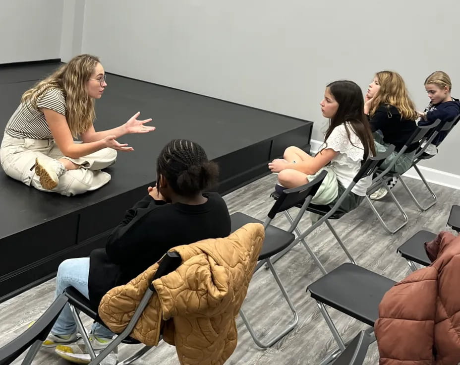 a group of people sitting in chairs