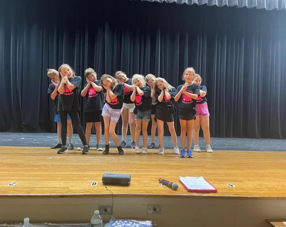 a group of girls on a stage