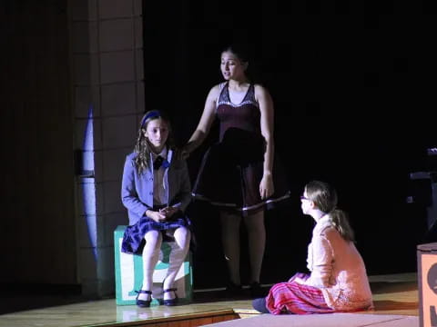 a group of girls on a stage