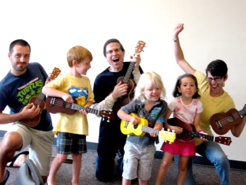 a group of people holding guitars