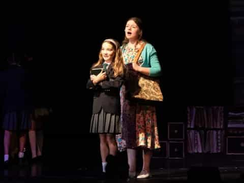 a group of girls on a stage