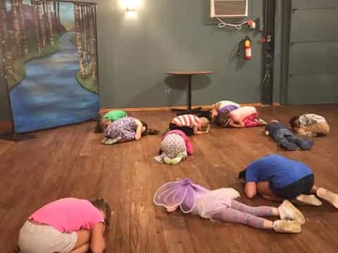 a group of children lying on the floor