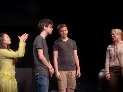 a group of people standing in a room