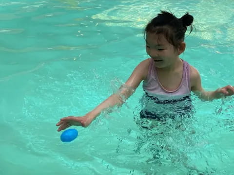 a girl playing in the water