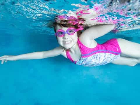 a person swimming in a pool