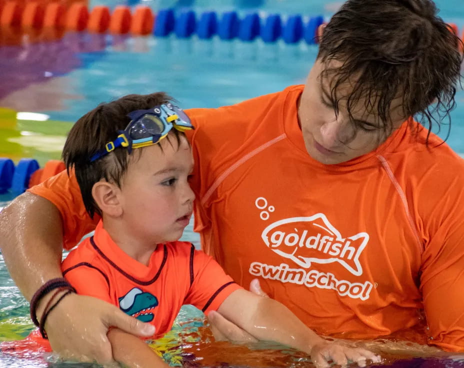 a man and a child in a pool