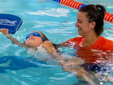 a person and a child in a pool