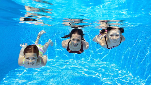 a group of people swimming