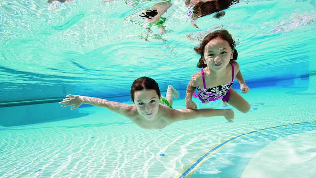 a man and woman in a pool