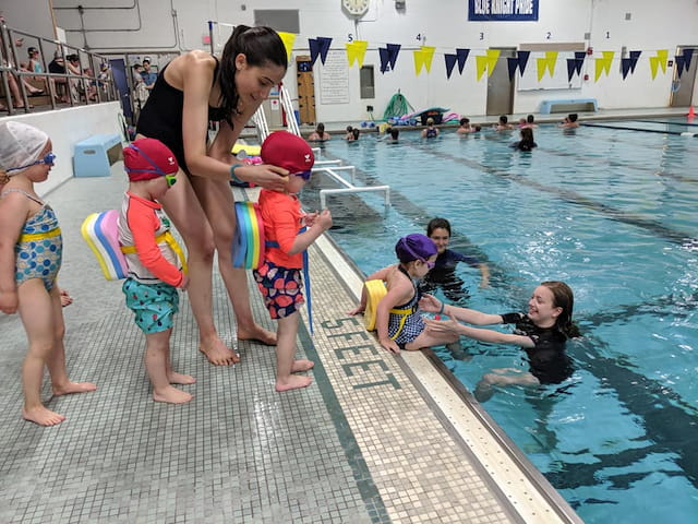 a group of children in a pool