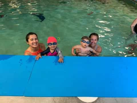 a group of people in a pool