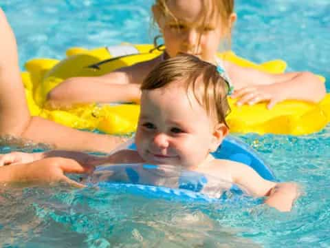 a group of kids in a pool