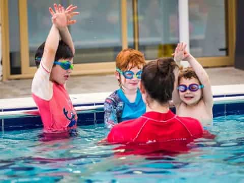 a group of kids in a pool