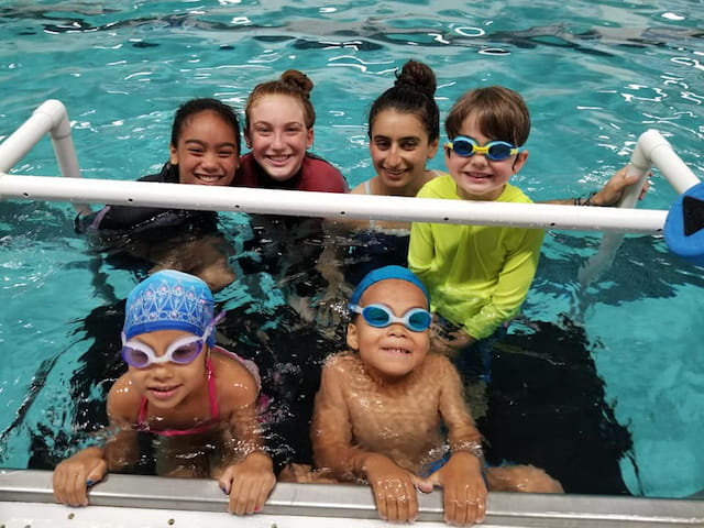 a group of kids in a pool