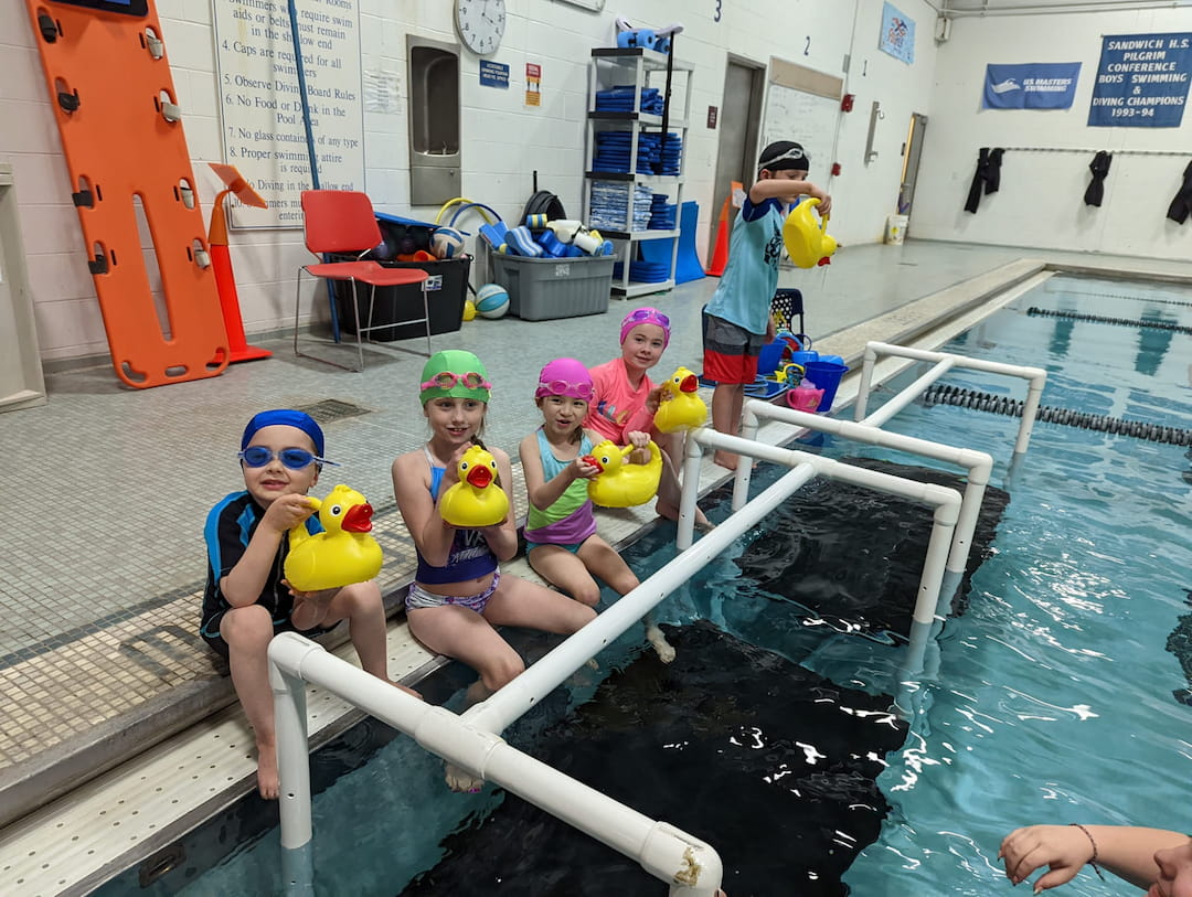 a group of kids in a pool