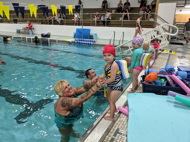 a group of people in a pool