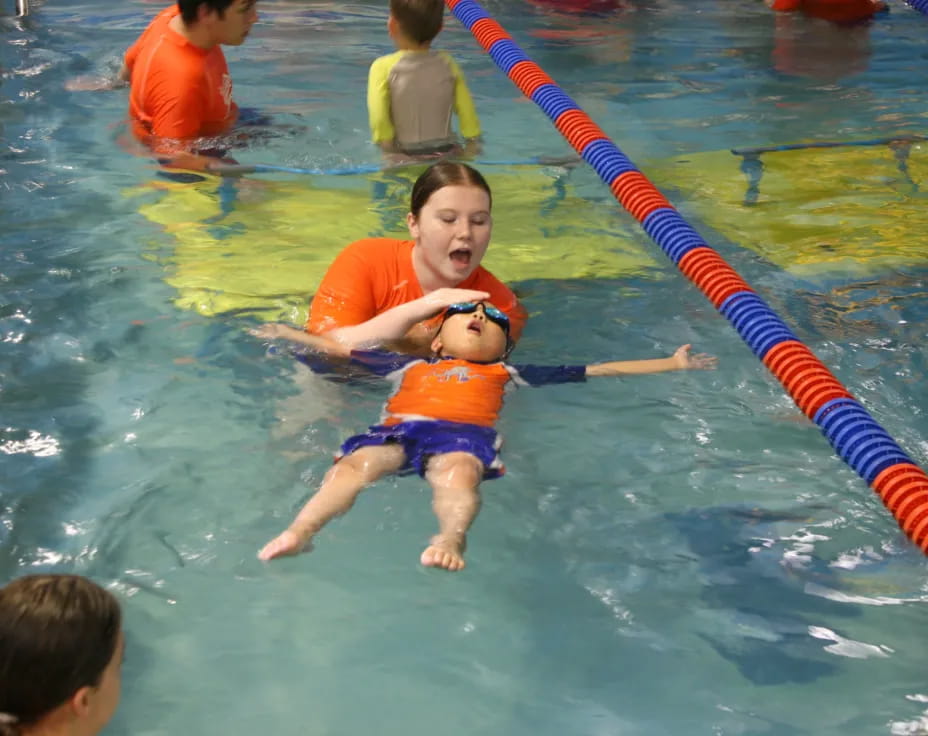 a group of kids in a pool