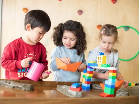 a group of children playing with toys