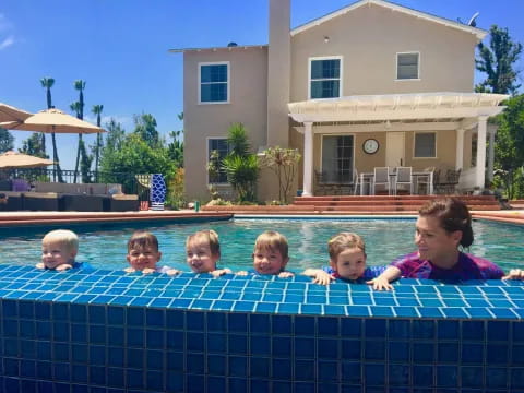 a group of kids in a pool