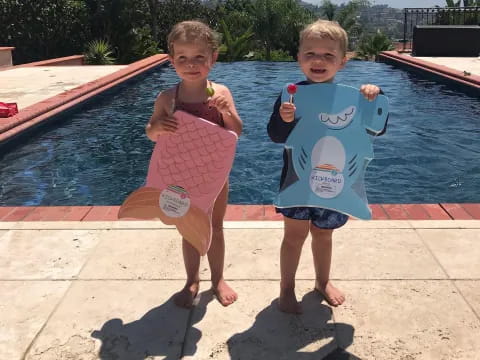 two children holding toys