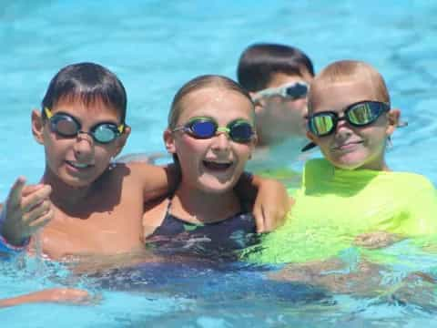 a group of kids in a pool