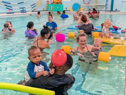 a group of children in a pool